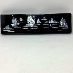 Long black lacquer box with alabaster inlay.